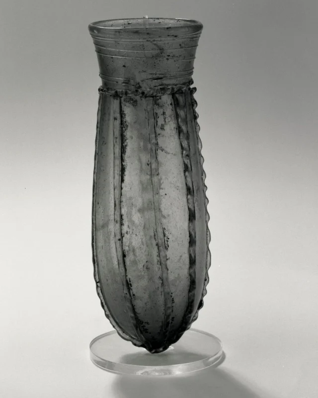 This week #Take5 takes a look at Anglo-Saxon glassware. Glass in the Anglo-Saxon period was used in the manufacture of a range of objects including vessels, beads, windows and jewellery. We are going to focus on vessels and it’s a two-parter because there are quite a few vessel types! The vast majority of complete vessels come from early Anglo-Saxon cemeteries – later burials contain fewer grave goods and glass is rarely found. Excavation of Anglo-Saxon sites has produced some evidence for limited glass working but it is still not known how much glass working took place in the Anglo-Saxon period and how widespread it was.

(All images © The Trustees of the British Museum. Shared under a CC BY-NC-SA 4.0 licence).

1: Bag Beaker – a long cylindrical beaker with a rounded bottom. This one was found at King’s Field in Faversham, Kent, and dates to the 7th century.

2: Globular Beaker – beakers with a narrow neck and round body. They were the most common type of vessel in the 6th and 7th centuries. This one was also found at King’s Field in Faversham, Kent, and dates to the 7th century.

3: Bell Beaker – long cylindrical beakers with a pointed base that look like upturned bells. This one was found in Buckland, Dover, and dates to the late 5th to early 7th century.

4: Claw Beaker – vessels with applied claw shape decoration. This one was found in Mucking, Essex. Date not recorded.

5: Cone Beaker – a tall tapering vessel with a pointed or curved base. This one was found in Kempston, Bedfordshire, and dates to the 5th-6th century.

#AngloSaxon #AngloSaxonGlass #EarlyMedieval #EarlyMedievalGlass #Glass #Glassmaking #HistoricGlass #MedievalArchaeology